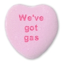 we've got gas written on a pink candy heart