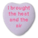 i brought the heat and the air written on a purple candy heart